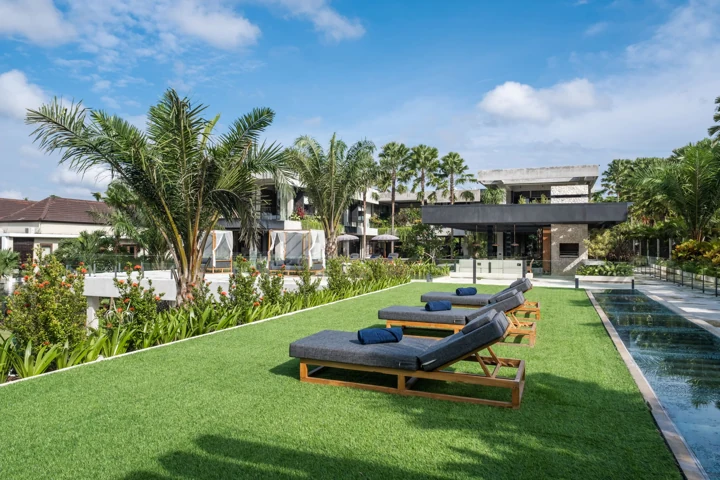 Garden lawn and daybed alongside the villa