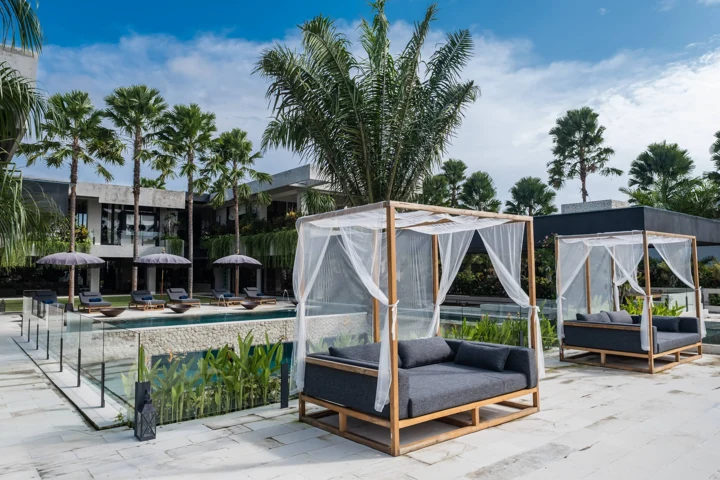 Canopied daybed beside the pool